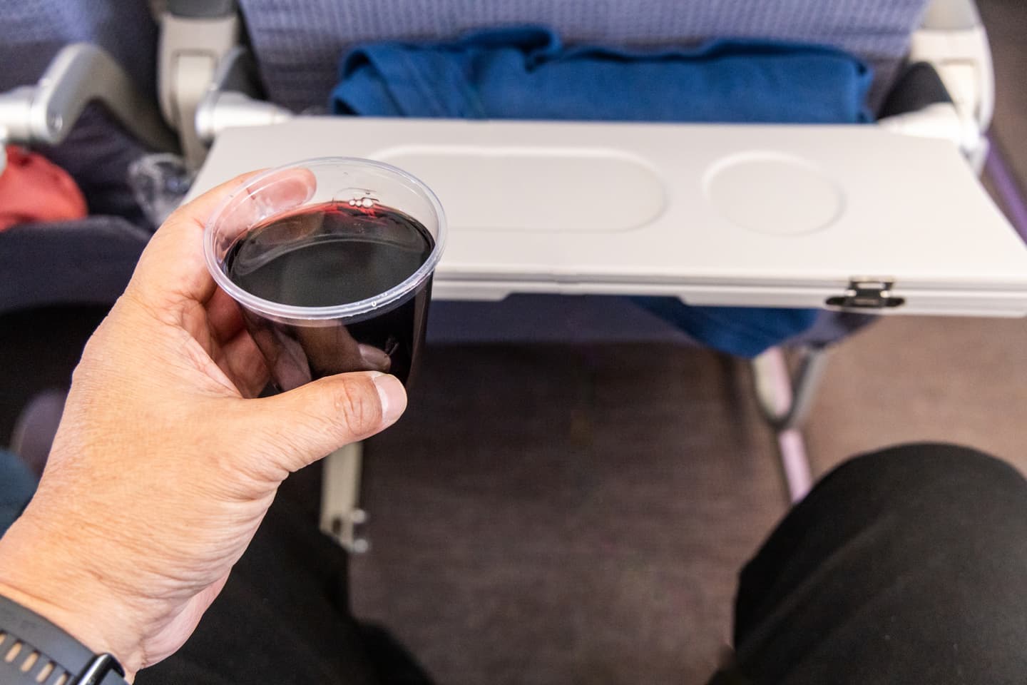 gettyimages-thamkc-airplane-interior-wine-plane-cabin.jpg