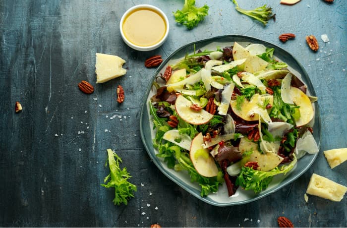 Healthy salad with dressing on the side